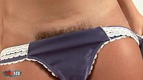 When she removes her panties she reveals a beautiful hairy pussy!