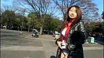 Asian floozy taking off her clothes in public