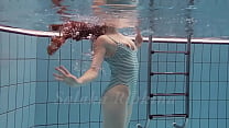 Horny Czech babe Salaka swims nude in the Czech pool