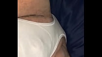 Guy modeling white panties In bed