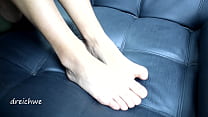 Foot fetishes on black sofa