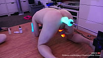Locked in glow in the dark cock cage and machine fucked by neon dildos