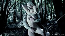 Hot busty blonde tied up between trees and gagged and pussy fingered