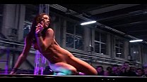 Erotic dancers strut their stuff on stage in front of a live audience