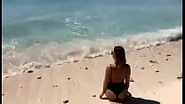 Alisa in getting hot on the beachfront!