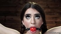 Gagged pale brunette slave Joseline Kelly in eagle spread rope bondage  standing on her toes then in hogtie suspension and doggy position gets whipped
