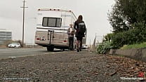 Sexy local shemale Kimberly invites herself in the camper of handsome Ned Mayhem and there fucks his throat and ass with big cock