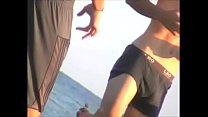 shorts stripped n ripped on beach, exposed left holding up