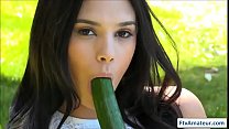 Brunette busty girl fuck her pussy with cucumber outdoors