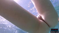 Hot Russian blonde model Clarcie takes off her clothes in the pool and looks tight