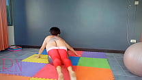 Regina Noir. A woman in yoga leotards practices yoga in the gym. Transparent red leotard yoga. FULL VIDEO