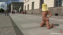 Little Romanian babe Amabella is chained and left down on knees posing in public square then analfucked by big dick Zenza Raggi all over town