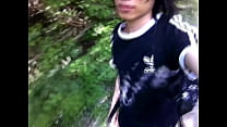 Gay twink pissing outdoors and walking sexy in the forest