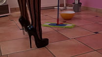 SEXY LADY CLEANS THE FLOOR IN HIGH HEELS  FASHION CATSUIT