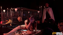 Brunette Japanese in cage pisses after playing with food next to a group of men
