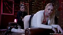 Lesbian domme in lingerie and fishnets fucks sexy pale blonde with strap on cock