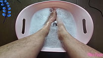 wash and scrubbing huge dirty hairy ebony feet
