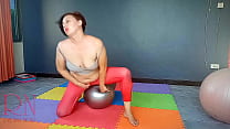 Regina Noir. A woman in yoga leotards practices yoga in the gym. Transparent red leotard yoga. Nude c12