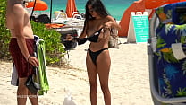 flashing her big tits at the beach with her husband waiting