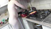 MILF naked woman continues to cook nude in kitchen