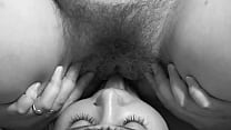 Lick your girlfriend's hairy cunt. A mature lesbian caresses a brunette. Cunnilingus. Black and white.
