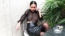 Young girl smokes topless and in leather skirt