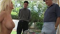 A sexy milf is getting fucked in front of two guys