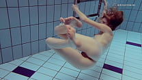 Petite cute Nastya swims underwater nude
