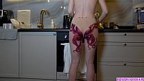 Totally nude MILF with huge kraken tattooed butt does daily routine on kitchen