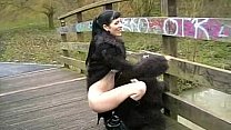 Goth Babe in Furry Coat Pisses Outdoors 1