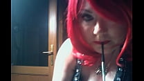 Chubby Domme Smokes A Vogue Cigarette With A Holder With Dangling