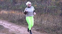 Pretty woman in leggings in the woods