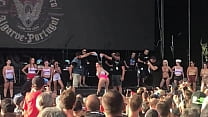 Women flashing her tits at a concert