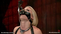 Small tits blonde slave Ash Hollywood in eagle spread bondage with head trapped in wooden box gets whipped then in sitting position tormented by lesbian domme Claire Adams