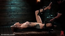 Huge tits tattooed brunette slave Rocky Emerson is bound in metal device on wooden box gets shaved pussy fucked with dildo on a stick then laid on the floor and cattle prodded by master The Pope