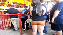 Big butt in orange shorts