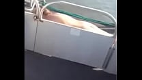 blonde MILF sun bathing Naked on pontoon boat