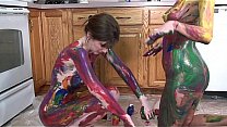 Lavender Rayne and Indigo Augustine playing with paint