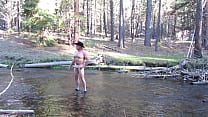 Naked in the river.