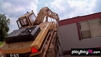 Busty nude beauties testing huge machines at a construction yard