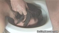 Pretty brunette sucks in the toilet