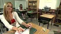 Brunette shemale student Kelly Klaymour and blonde Roxy Rox pull up their uniforms and rough fuck with big dick in classroom over table