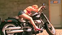 Horny Jenna Haven doing striptease on black bike