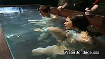Two bound babes submerged in water