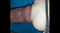 Male masturbation, using a toy.