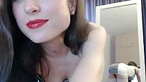 Sexy brunette in stockings teasing on webcam
