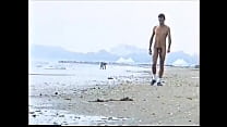 amatorial young boy walking naked on the beach