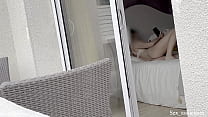 Secretly filmed a pregnant girl in a hotel through shared balcony.