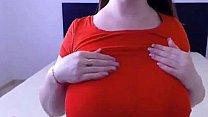 Big titted MILF toys her shaved pussy on cam